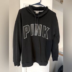 PINK sweater. Runs big.